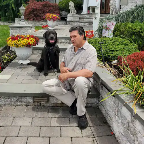 Alpha Dog K9 trainer working on a dog's behavior during an in-home session